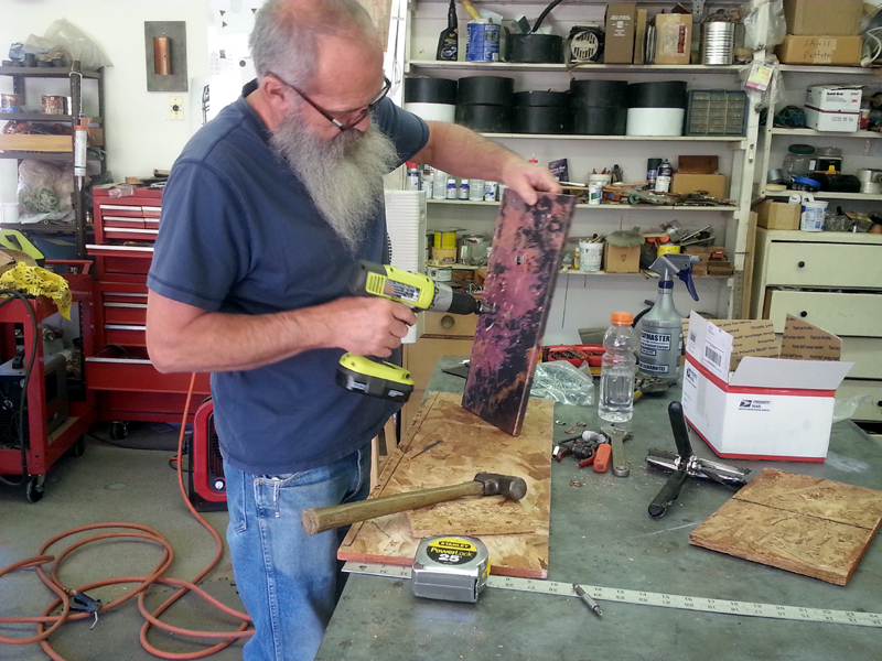 Mike Creating Backs for Copper Light Sconce-Mike Dumas Copper Designs Inc.