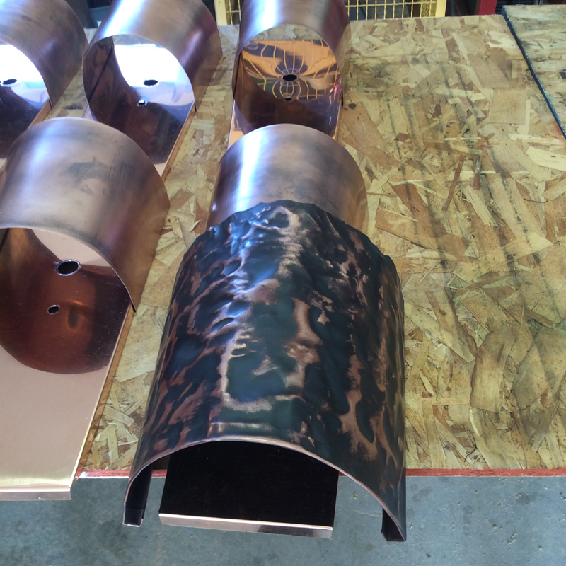 Copper lighting // rustic style // slate finish // raw copper in the copper shop of Mike Dumas Copper Designs.