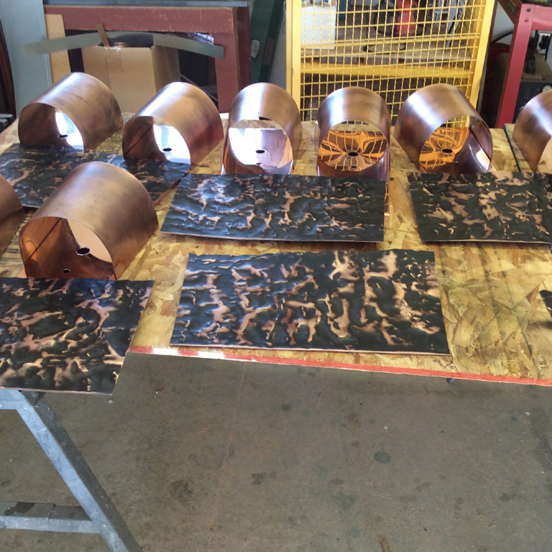 Copper lighting // rustic style // custom lights in the copper shop of Mike Dumas Copper Designs.